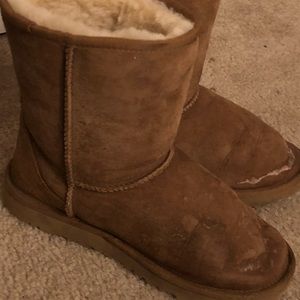 Damaged chestnut Ugg boots